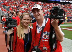 Ashley Cox and Kevin M. Cox on the field photographing the Houston Texans vs. Jacksonville Jaguars game on Sunday afternoon September 27, 2009 at Reliant Stadium in Houston.